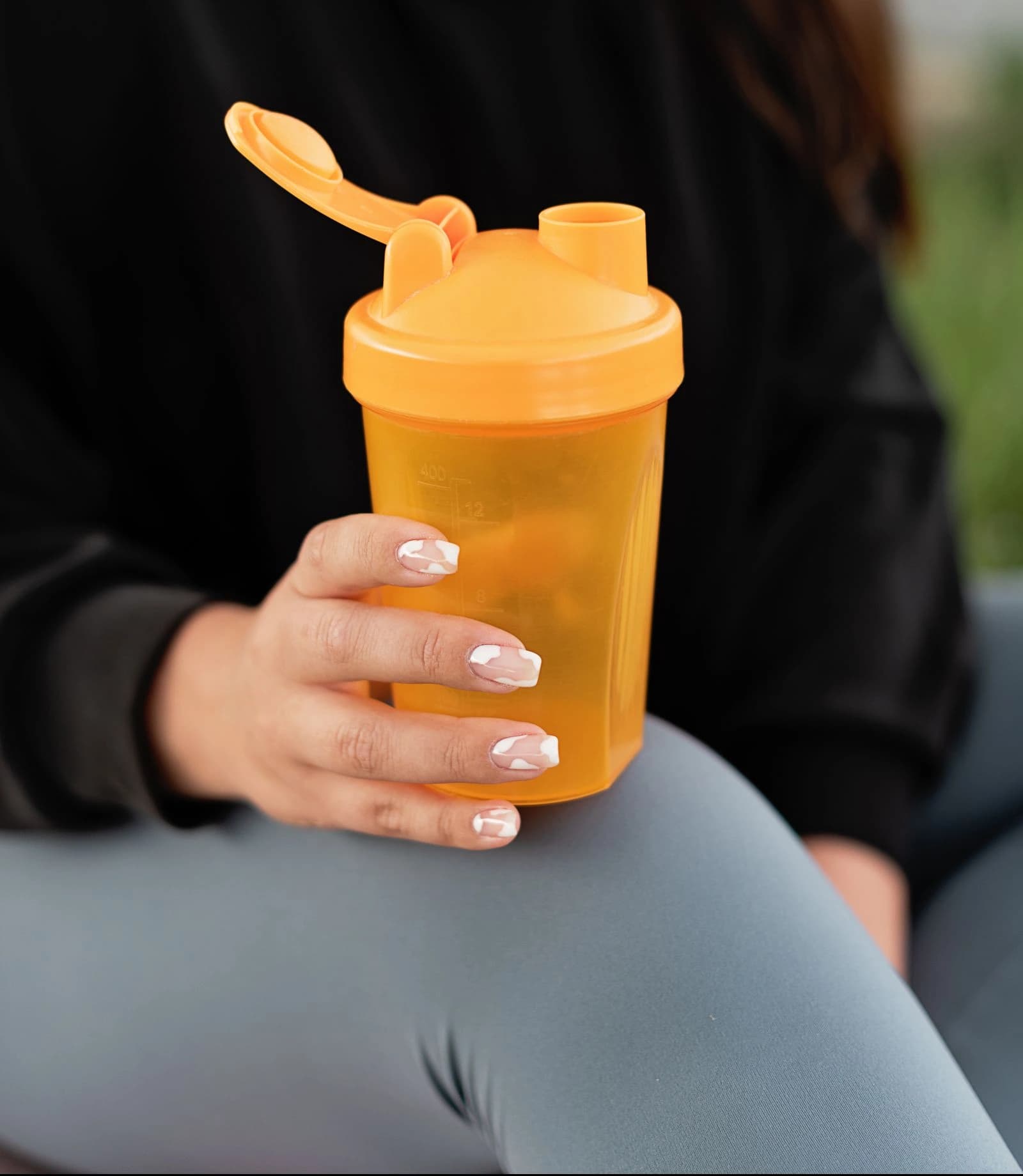 A protein shaker held after a workout